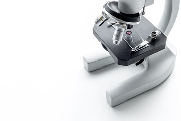 Blood test concept. Drop of blood under microscope on white background top view close up copy space