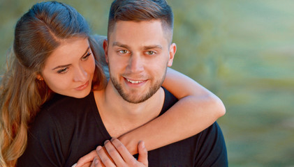 Young happy smiling attractive couple together outdoors