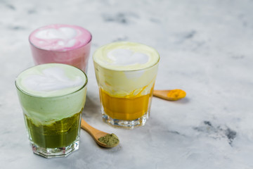 Selection of colorful super lattes on marble background