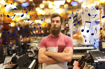 assistant or customer with beard at music store