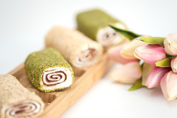 Fototapeta na wymiar slice of Homemade Sweet roll with chocolate and vanilla on white background