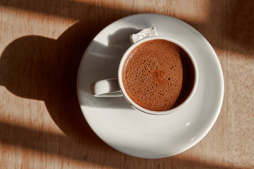 a cup of turkish coffee with foam