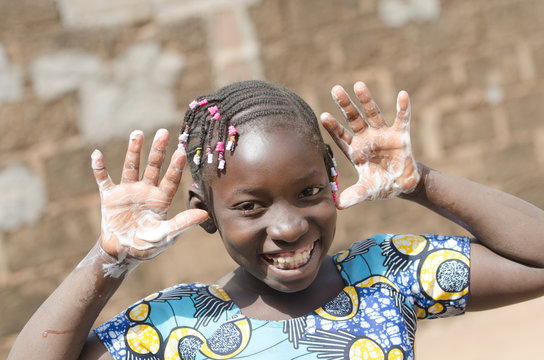 Huge Smile on Black African ethnicity Girl Soapy Water Hands