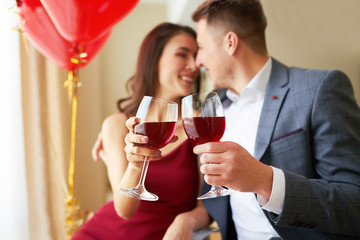 Valentine's Day concept. Happy couple in love with. A young loving couple celebrating Valentine's Day in the restaurant. Lovers give each other gifts. Romance restaurant for Valentine's Day- concep
