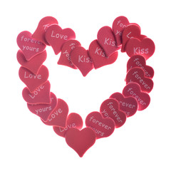 Red hearts confetti on white background with words love kiss
