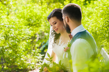 Portrait of bride and groom in fairytale park