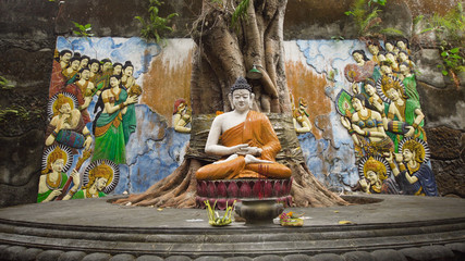Statue of the Buddhist God Buddha in the Buddhist temple Brahma Vihara Arama with statues of the...