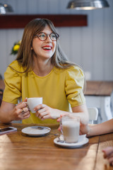 Woman Drinking Coffe at Cafe