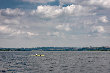 Girls in training for a boating competition on the lake.