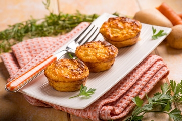 carrot and potatoes muffins, selective focus