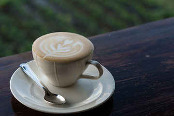 Cup of fresh espresso coffee foam on wooden table, Evening scene, Morning scene, Macro image