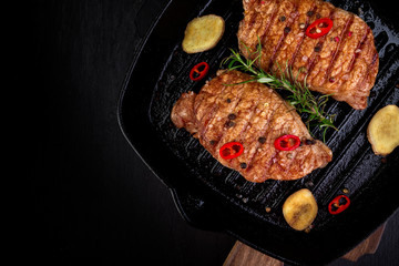 Grilled pork steak in grill pan
