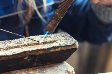 Craft jewelery making with flame torch