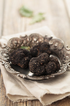Black truffles on plate.