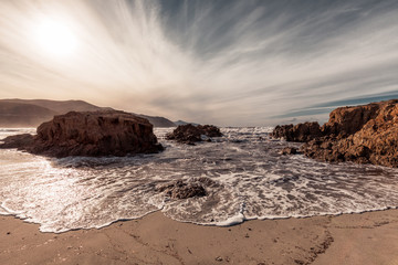 Fototapeta na wymiar Waves washing onto Ostriconi beach in Balagne region of Corsica