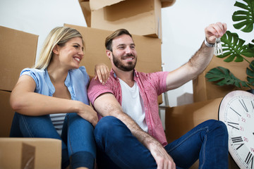 Young couple celebrating moving to new home