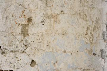Wall fragment with scratches and cracks