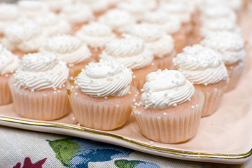 A platter of mini vanilla cupcakes