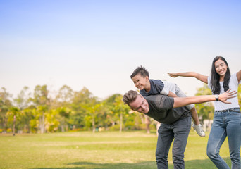 Obraz premium Dad and son having fun outdoors.concept of a happy family.
