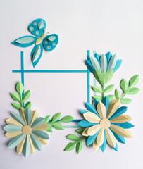 Square frame with blue color paper flowers and butterfly