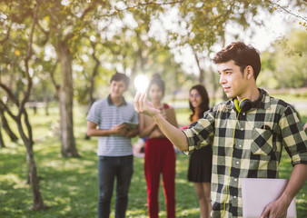 Fototapeta premium man teen student holding to the illuminated bulb .Light Bulb Think Ideas Create