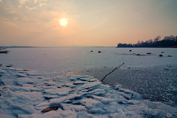 View of a frozen lake on a late winter afternoon.