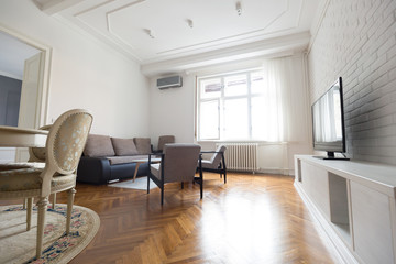 Bright spacious living room with chairs table inside