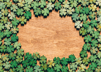 Four-leaf clovers laying on wooden floor