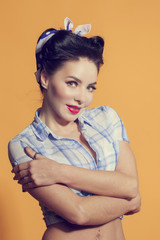 girl in pin-up style hugging his hands