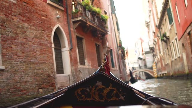 Gondola ride in Venice Italy with focus in the nose of the gondola Stock Footage