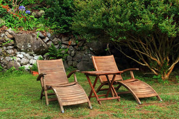 Chaise - longues in the garden