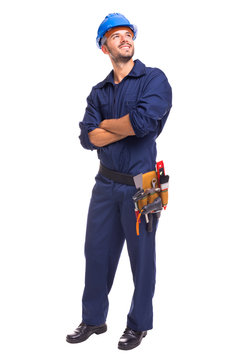 Full length of a young worker standing on a white background