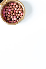 Pink blush in the balls on a white background
