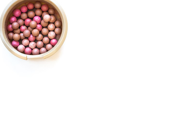 Pink blush in the balls on a white background
