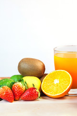 Healthy concept with mixed fruits and vegetables on wooden background