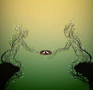 two spring tree silhouettes looks like man and woman and holding the nest with white pigeeons, family concept,