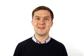 Fototapeta premium Portrait of a smiling young man dressed in a black sweater and a light jacket