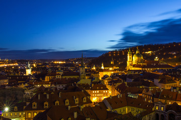 Beautiful Night view over the Vltava river, Charles bridge, the embankment Smetanovo, tower old city, Church St. Nicholas and whole Prague. Popular European travel destination. Chech Republic.