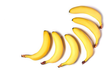 Ripe yellow bananas on a white background