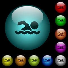 Swimming man icons in color illuminated glass buttons
