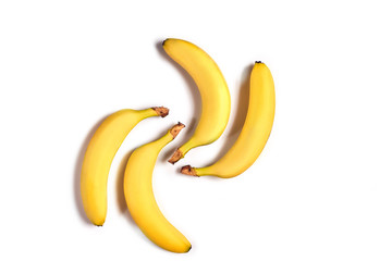 Ripe yellow bananas on a white background