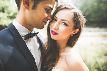 Sensual portrait of a young wedding couple. Outdoor