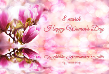 Happy Women's Day lettering on a pink background with blur and pink magnolias reflecting in the water