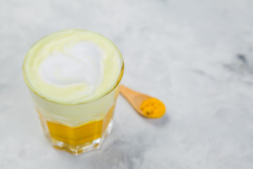 Turmeric super latte on marble background