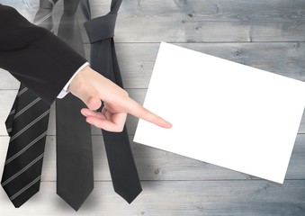 Businessman pointing with chart on white card with tie's