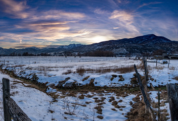 Panorama of a winter landscape at sunset in the mountains