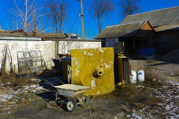 Old milk storage tanks. Premises of a destroyed and plundered milk production plant. The raiders captured the plant. Vandalism. Ukraine, January 2018.