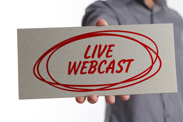 The concept of business, technology, the Internet and the network. Young businessman showing inscription: Live webcast
