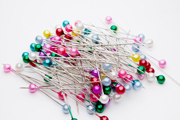 dressmaker pins on white background