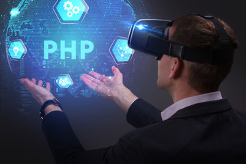 Business, Technology, Internet and network concept. Young businessman working on a virtual screen of the future and sees the inscription: PHP